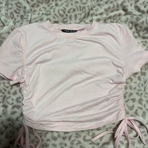 Pink shirt with rubbed sides